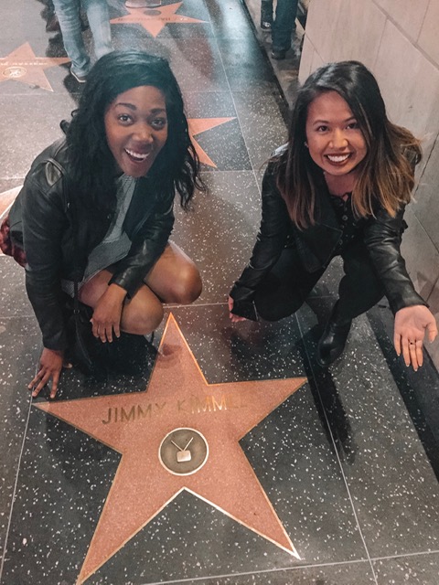 Two girls at the Hollywood walk of fame.