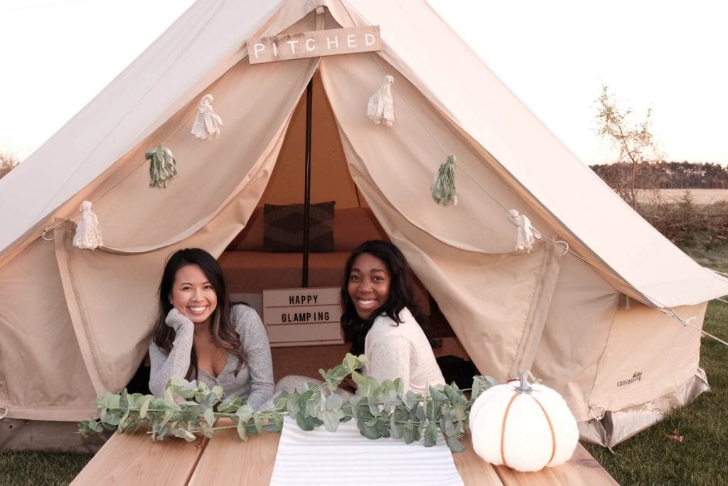 Wunmi and Phi Phi outside of their Pitched tent 