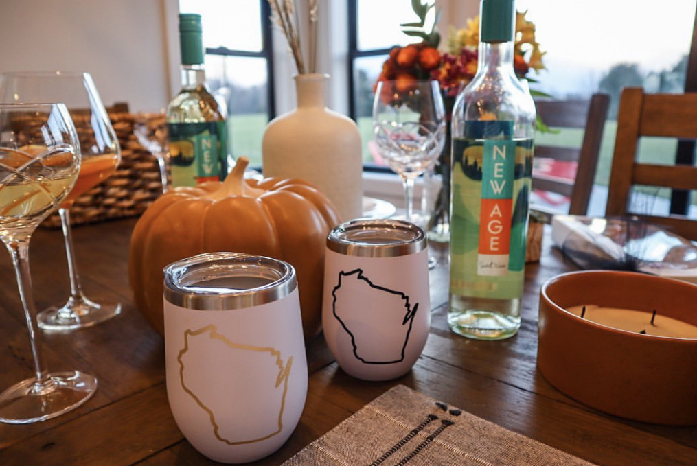 Friendsgiving setting with Wisconsin themed wine tumblers