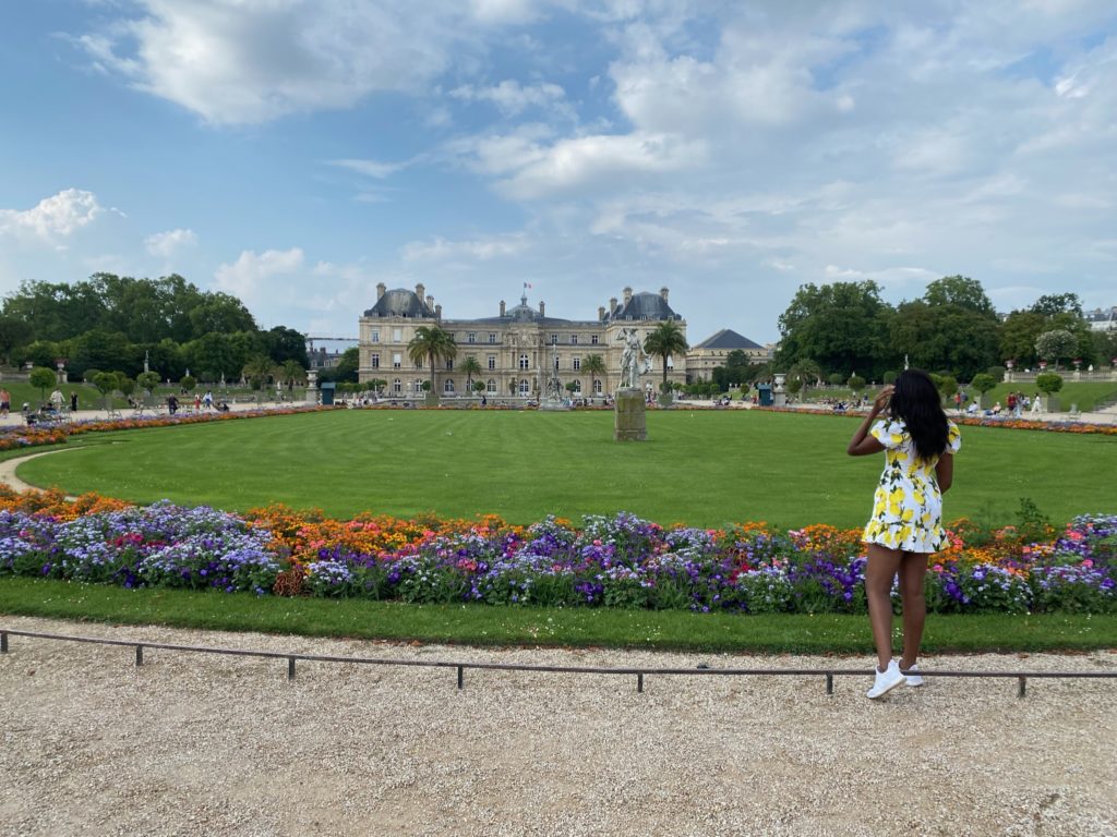 Luxembourg Garden in Paris France with a black girl staring in the distance