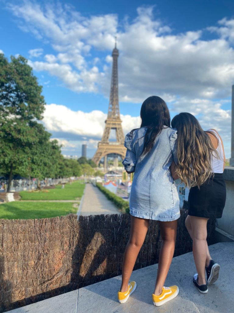 Two girls staring out at the Eiffel Tower in Paris 
