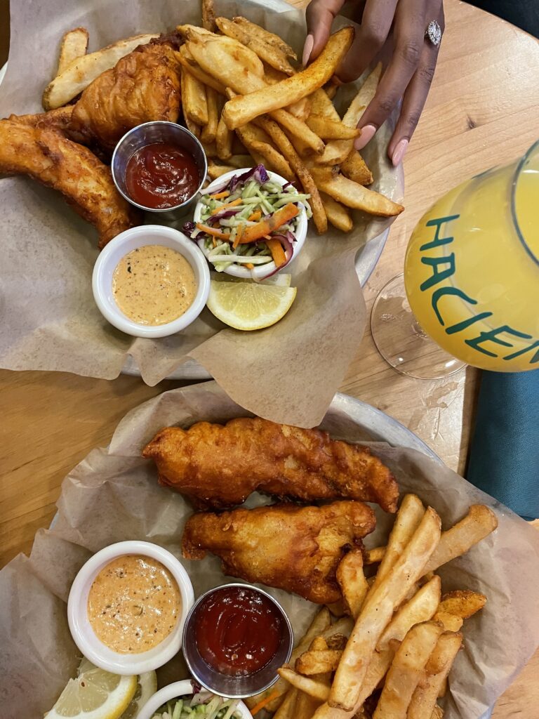Fish fry with french fries, aioli sauce and beer