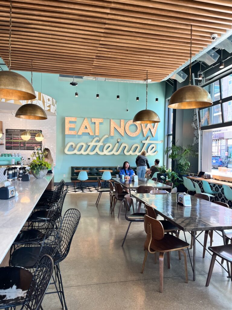 eat now, caffeinate sign